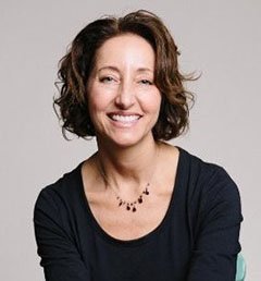 Headshot of Rima Cohen. Rima wears a black shirt.